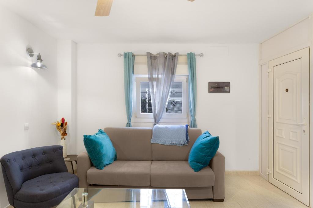 a living room with a couch and a chair at Casa Paula - 25 in Arinaga