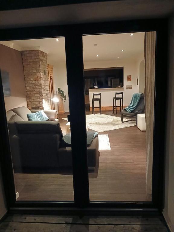 a view of a living room through a window at Sonnige Ferienwohnung Am Sternberg in Extertal