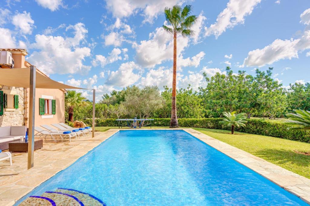 a swimming pool in the backyard of a villa at Villa Joana in Pollença