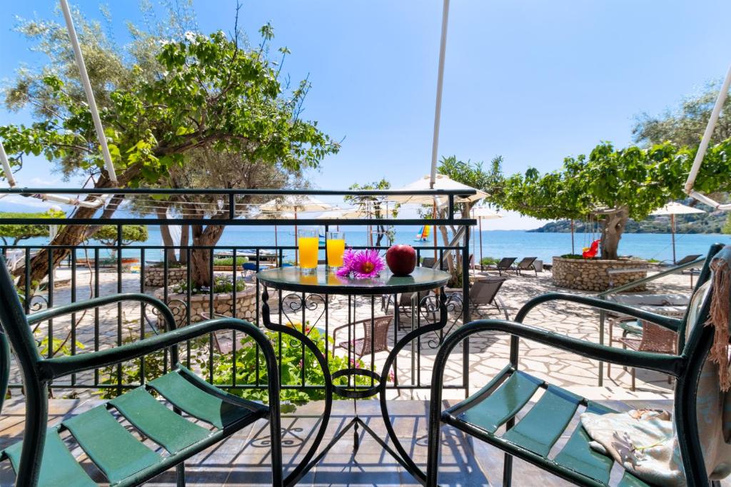 a patio with chairs and a table with drinks on it at Nikiana Club - Studio 4 in Nikiana