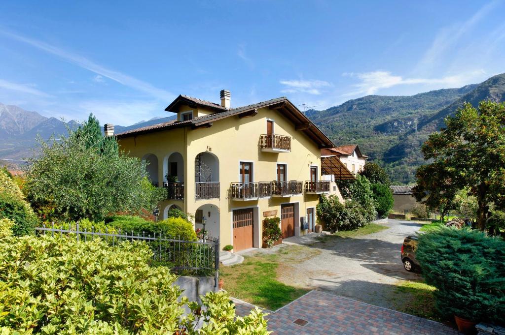 a house with a car parked in front of it at Maison Lorent in Champdepraz