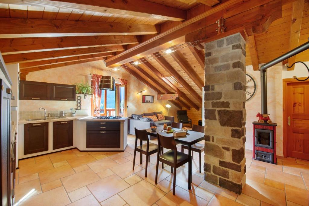 a kitchen and dining room with a table and chairs at Anita Haus - Issime in Issime