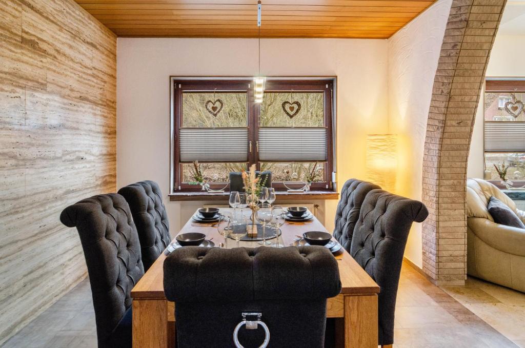 a dining room with a table and chairs at Fewo Jaeger in Bad Sachsa