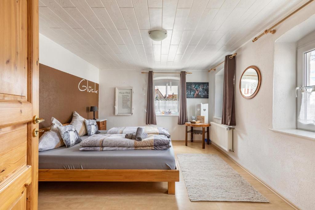 a bedroom with a bed in a room at Ferienhaus em Biehl in Frankenhofen