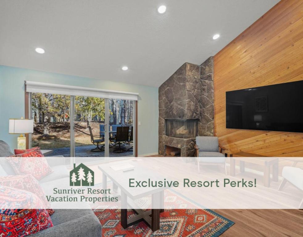 a living room with a tv and a fireplace at 4 Quelah Condo in Sunriver