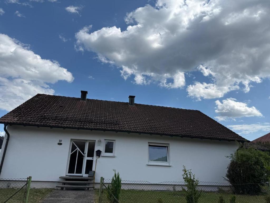 a white house with a brown roof at Casa Jo und Jo in Pfullendorf
