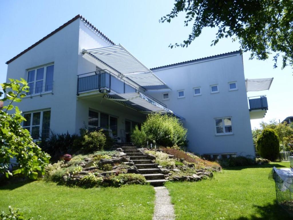 a house with a staircase leading up to it at Ferienwohnungen Böhme in Konstanz