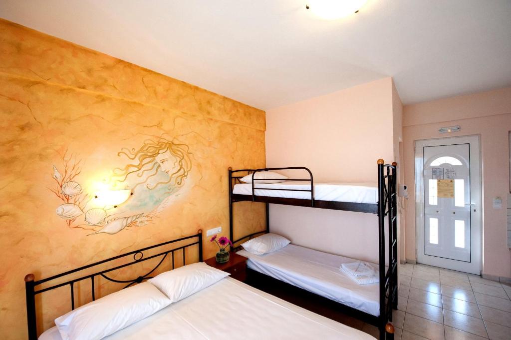 A bed or beds in a room at Effie's House