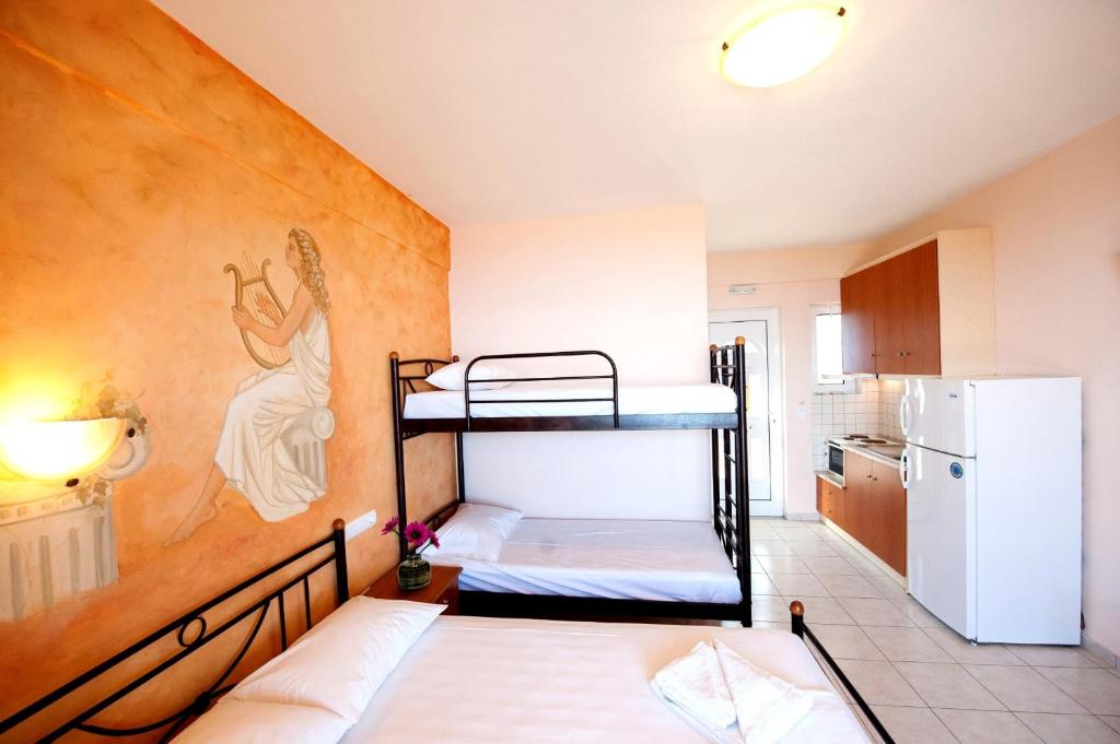 A bed or beds in a room at Effie's House