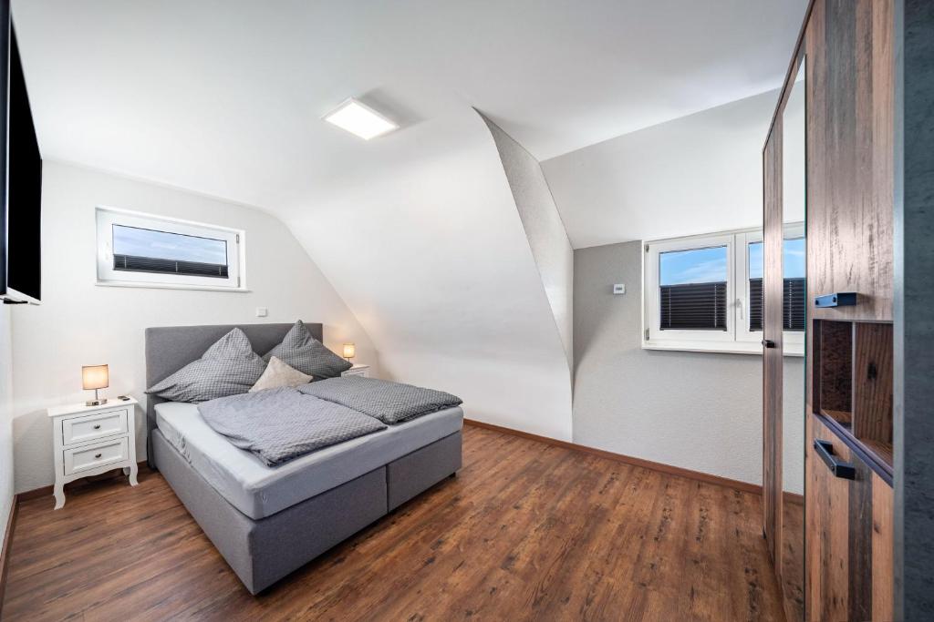 a bedroom with a bed in a attic at Schorsch's Ferienhaus in Winzeln