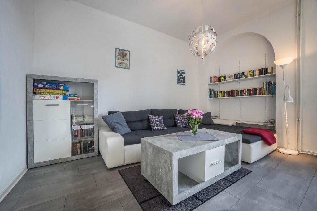 a living room with a couch and a table at Braunlageblick in Braunlage