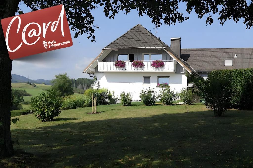 a cocacola sign in front of a house at Haus Intlekofer in Lenzkirch
