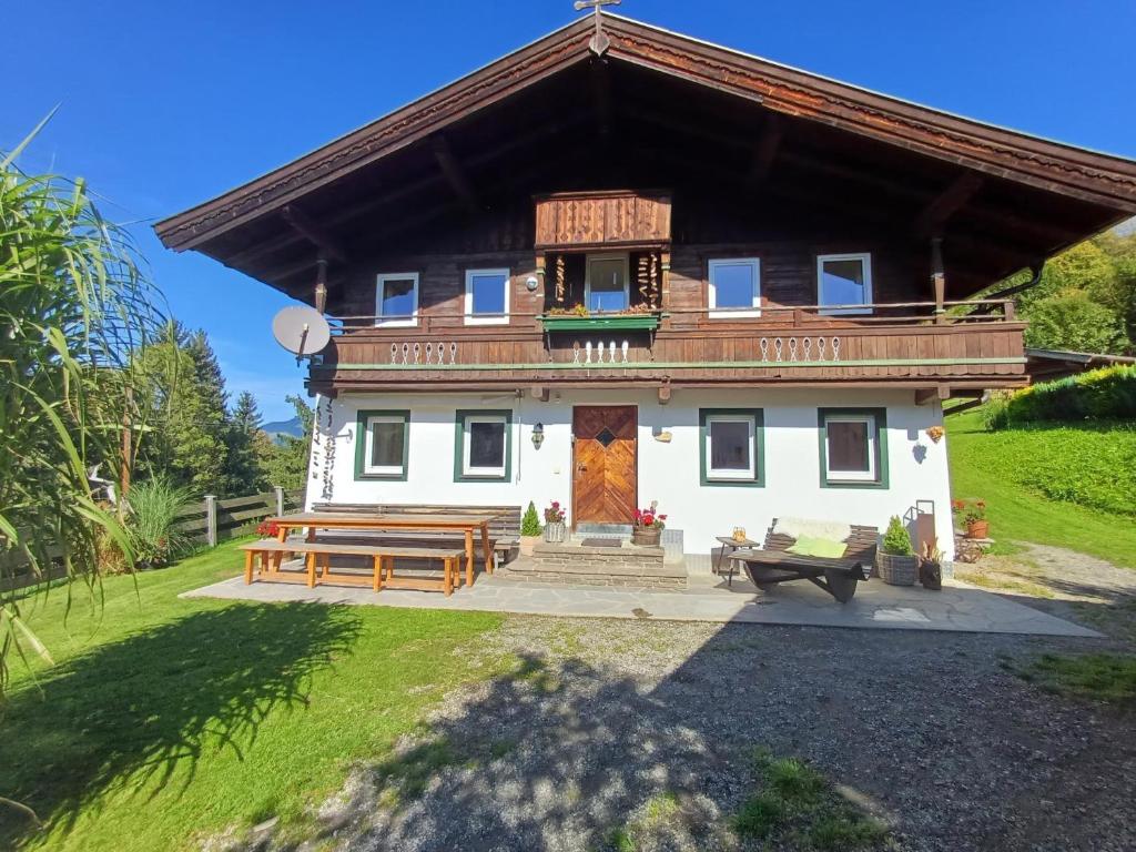 a house with a wooden roof at Ferienhaus Lemberger in Jochberg