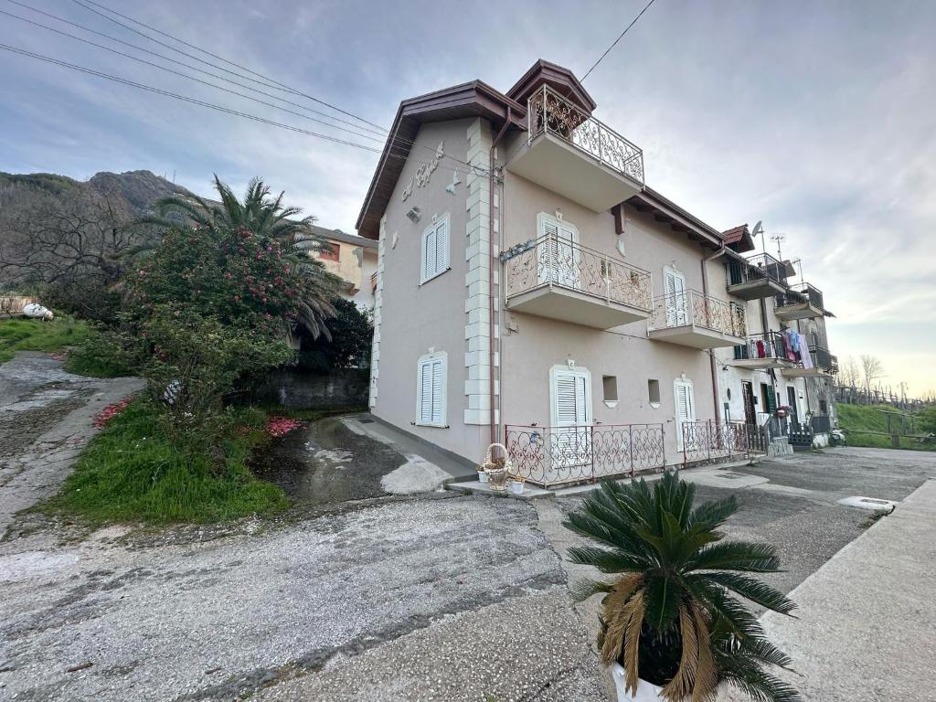 a large building with a balcony on a street at Bed And Breakfast Il Ceppo Wild in Pimonte