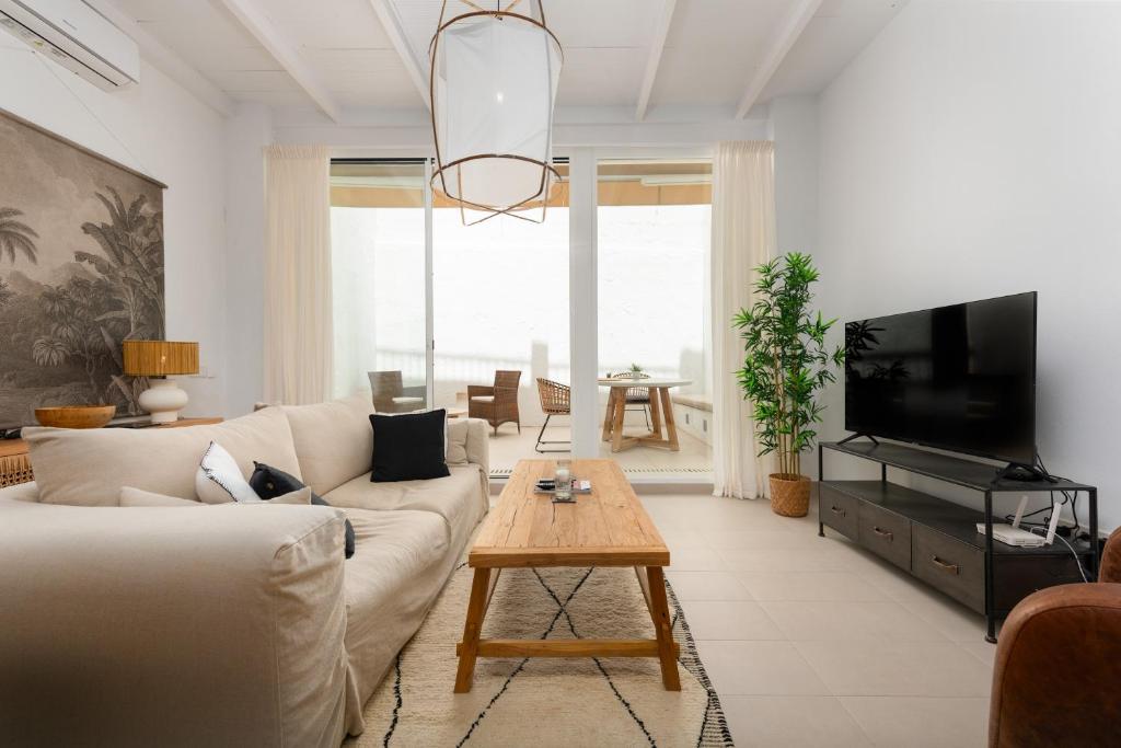 a living room with a couch and a table at Vivienda Casares in Estepona