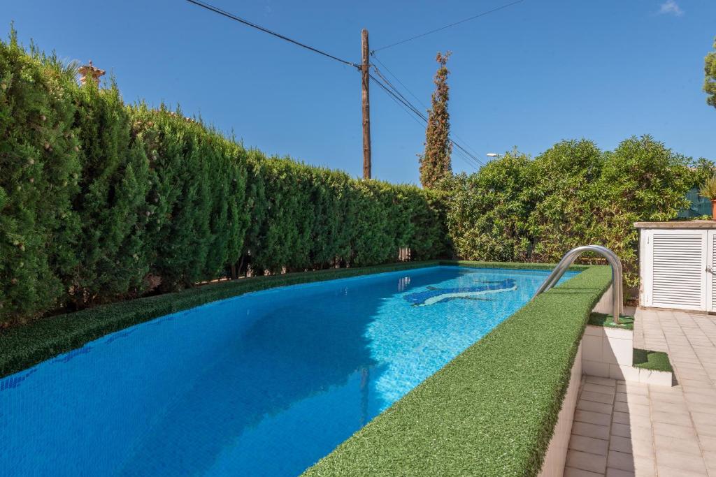 a swimming pool in a yard with trees at Villa Son Ferrer in Santa Ponsa