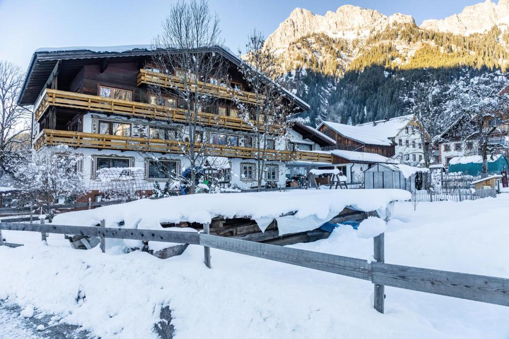 a lodge in the snow in a mountain at Berggold in Nesselwängle