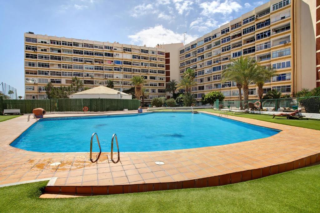 a large swimming pool in front of a large building at Los Molinos 538 in Maspalomas