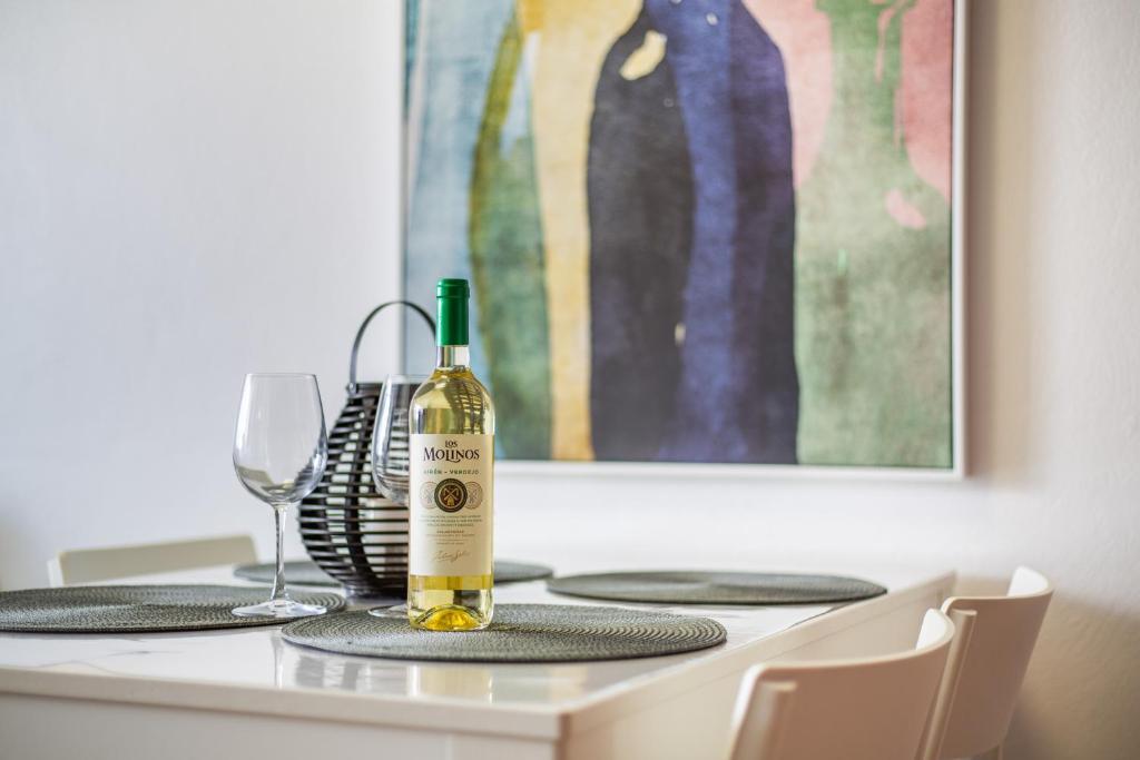 a bottle of wine sitting on top of a table at Casa Fabi in Arrieta