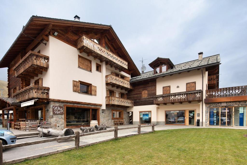 a large building with a car parked in front of it at I Mini Appartamenti in Livigno