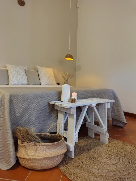 a living room with a table next to a couch at Meridiana case al mare in Mattinata
