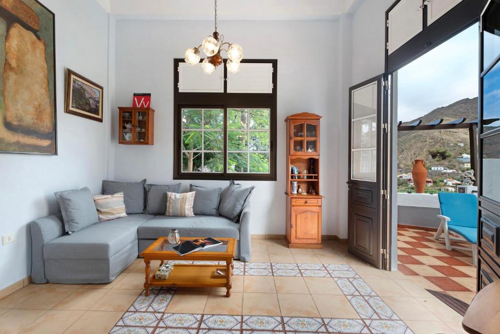 a living room with a couch and a table at La Huerta in Hermigua