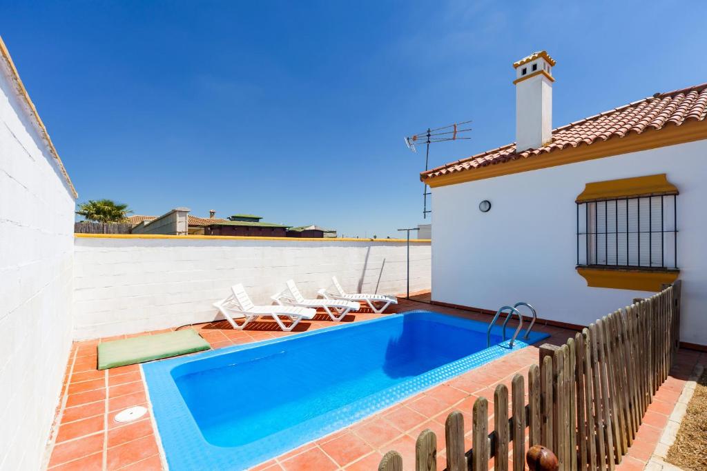 a swimming pool on the roof of a house at Chalet Bellavista in Conil de la Frontera