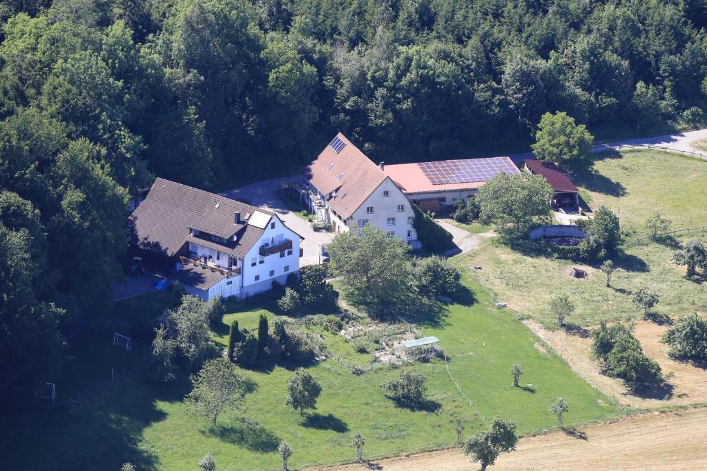 an aerial view of a large house on a green field at Ferienhof Siber in Owingen