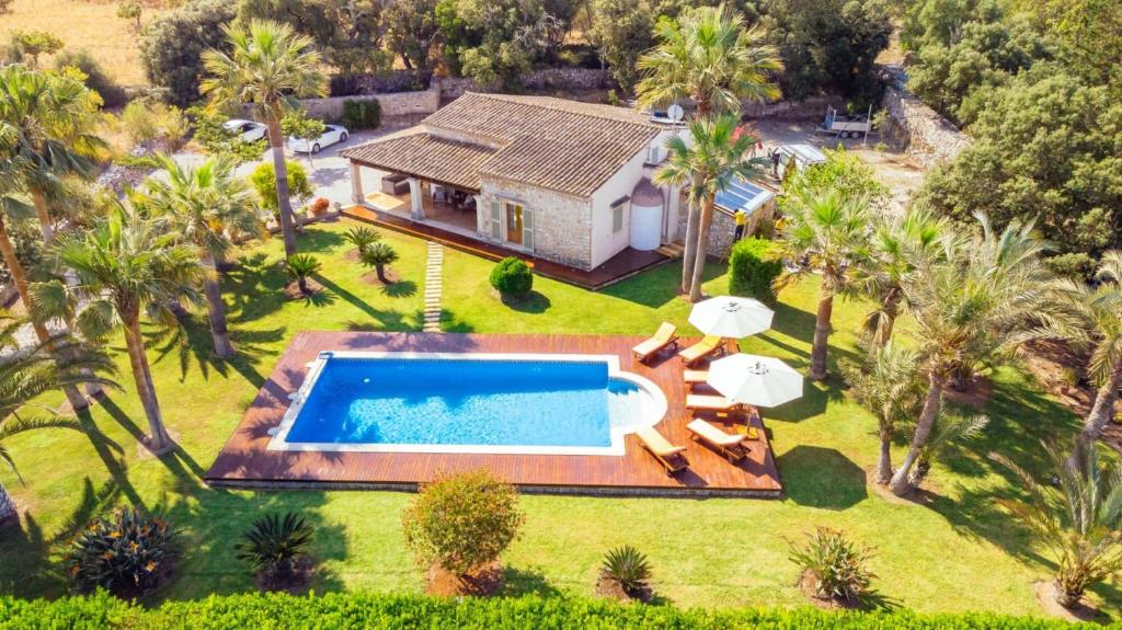 an aerial view of a house with a swimming pool at Can Xisco in Artá