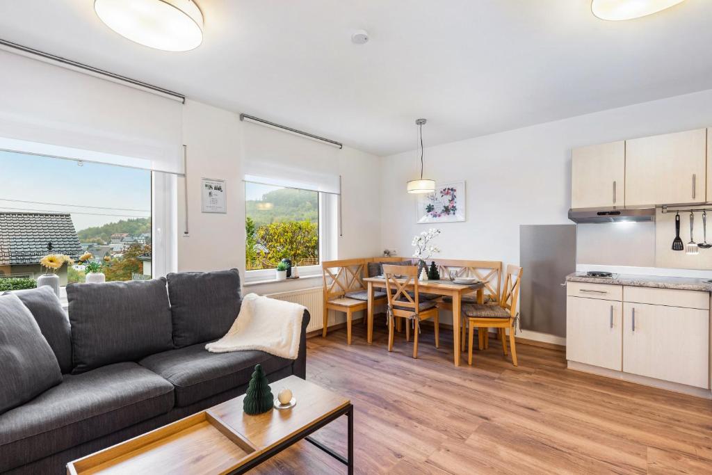 a living room with a couch and a table at Ferienwohnung Kraus in Katzenbach