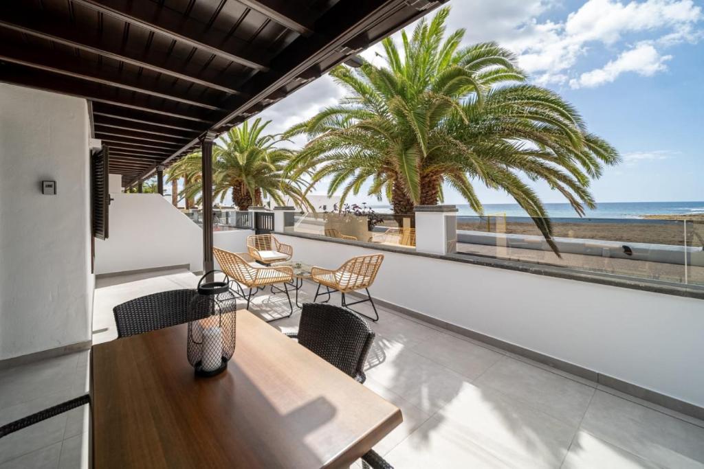 a view of the beach from the balcony of a house at Callao in Playa Honda