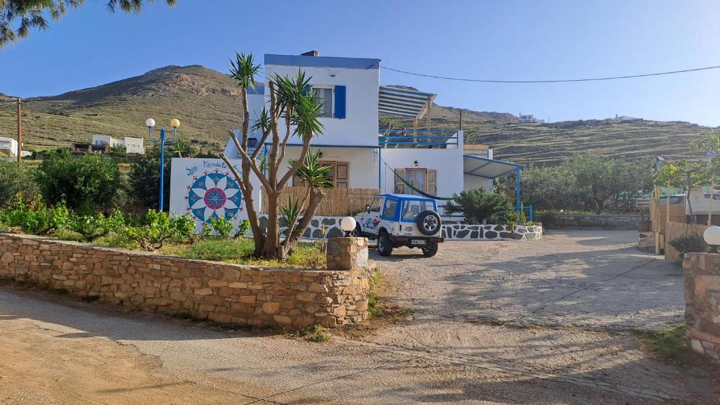 a blue truck parked in front of a house at Syros Mandala Studios in Megas Gialos - Nites