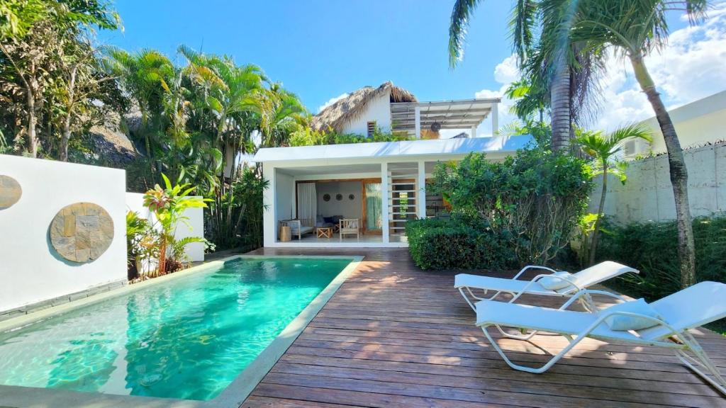 a villa with a swimming pool and a house at Casa Lowen Villa with Private Pool in Las Terrenas