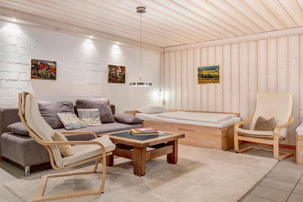 a living room with a couch and a table at Haus Erna am Deister Apartment in Barsinghausen