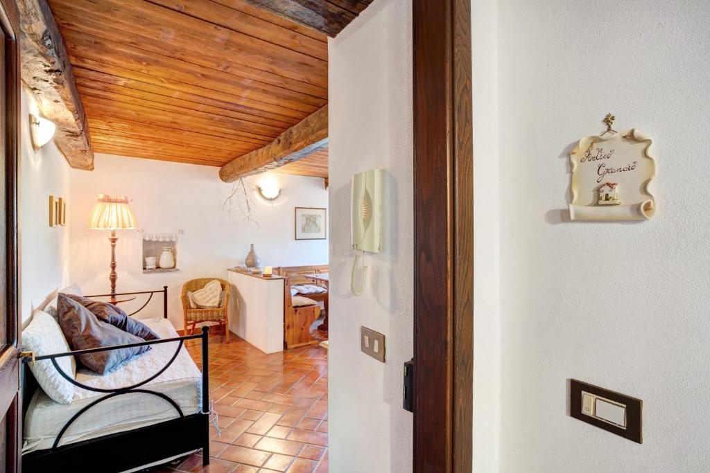 a hallway with a living room and a bedroom at Antico Granaio in Vessalico
