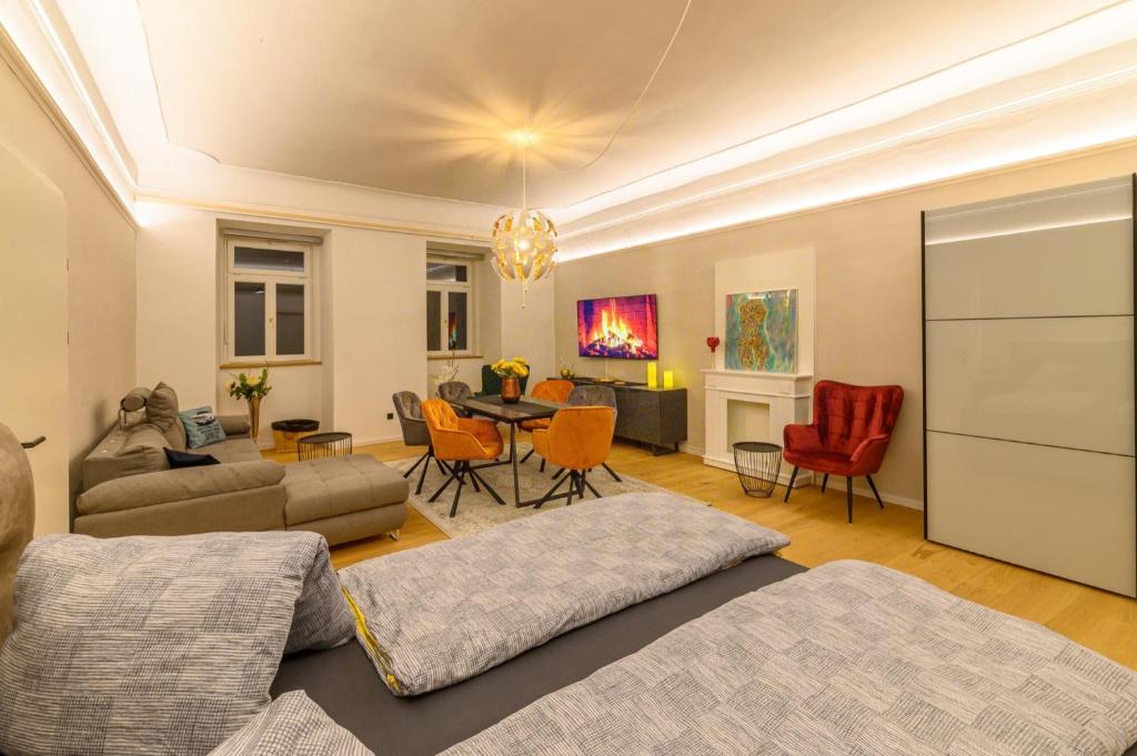 a living room with a couch and a table and chairs at Gh Alte Post - Top 4 Commodore in Gmünd in Kärnten