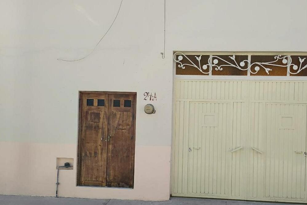 a pair of doors in a white room with at Tranquilidad y comodidad in Dolores Hidalgo