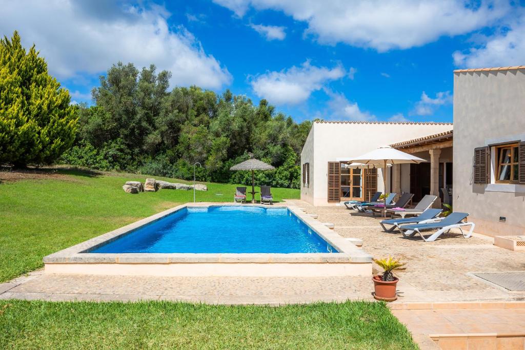 a pool in the backyard of a house at Finca Can Xerpeta in Son Servera