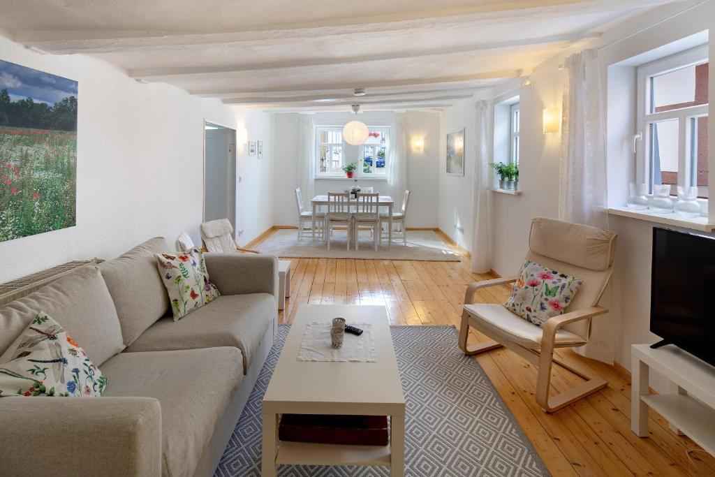 a living room with a couch and a table at Ferienwohnung Omi Anni in Schlitz
