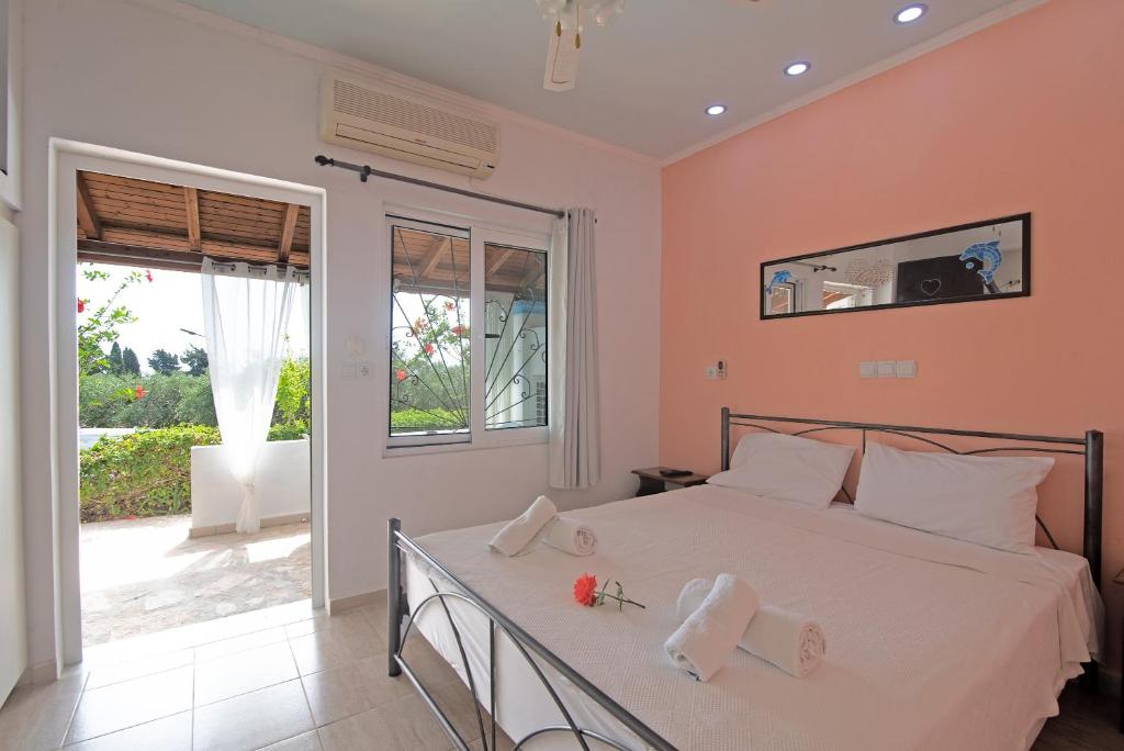 a bedroom with a bed with towels on it at Andromaches sea view studio 3 in Corfu