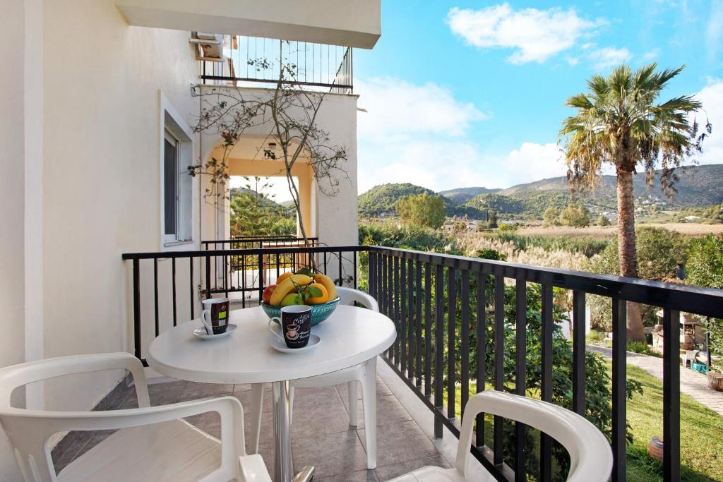 a table and chairs on a balcony with a view at Dolphin Studio Sea View 10 in Keri