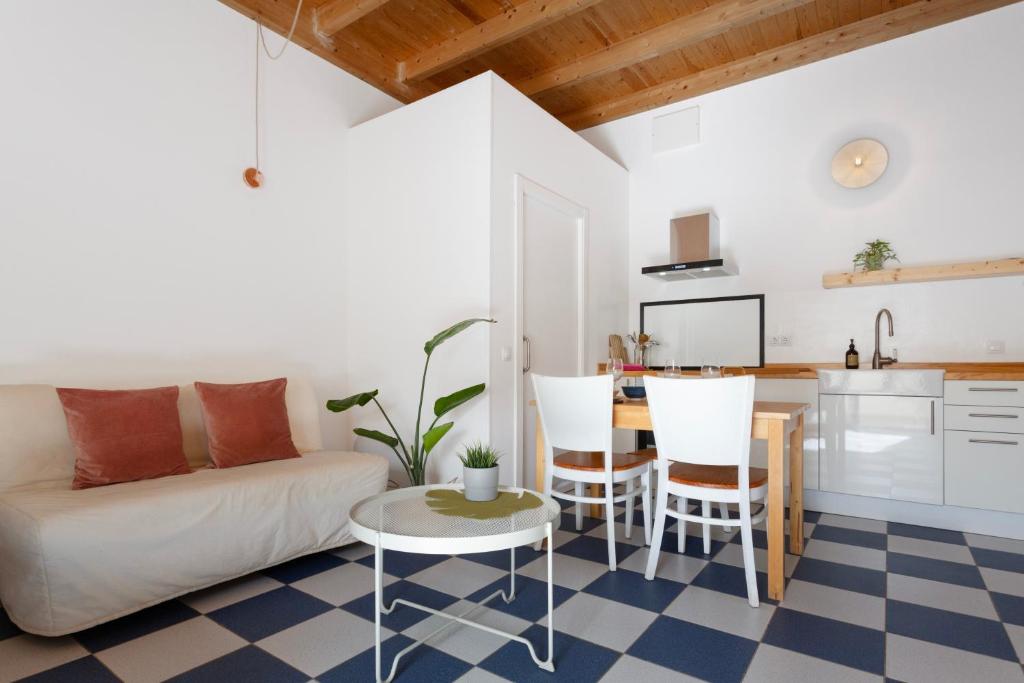 a living room with a couch and a table at Blue Oasis in El Cotillo
