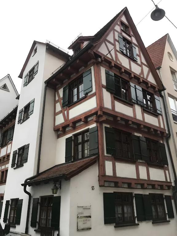 an old wooden building with black and white windows at Ulmer Spatzennest in Ulm