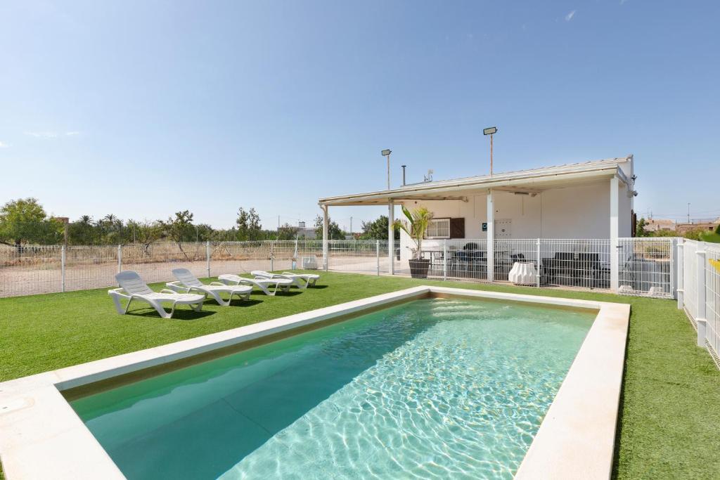 a swimming pool in the backyard of a house at Arizona in Pozo de los Palos