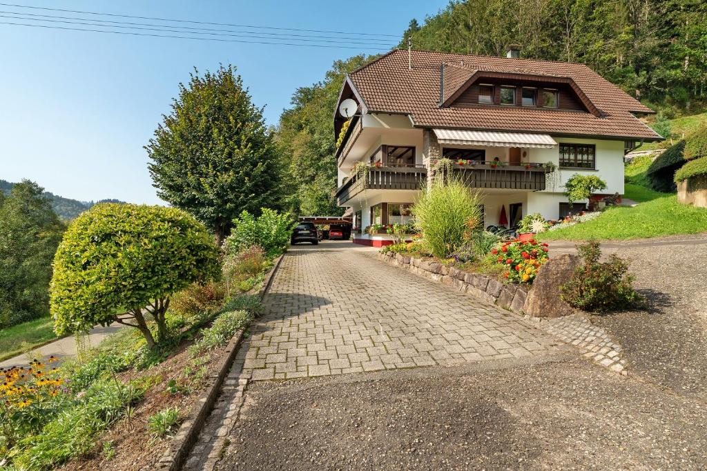 a house with a walkway in front of it at Haus Schindler in Ottenhöfen