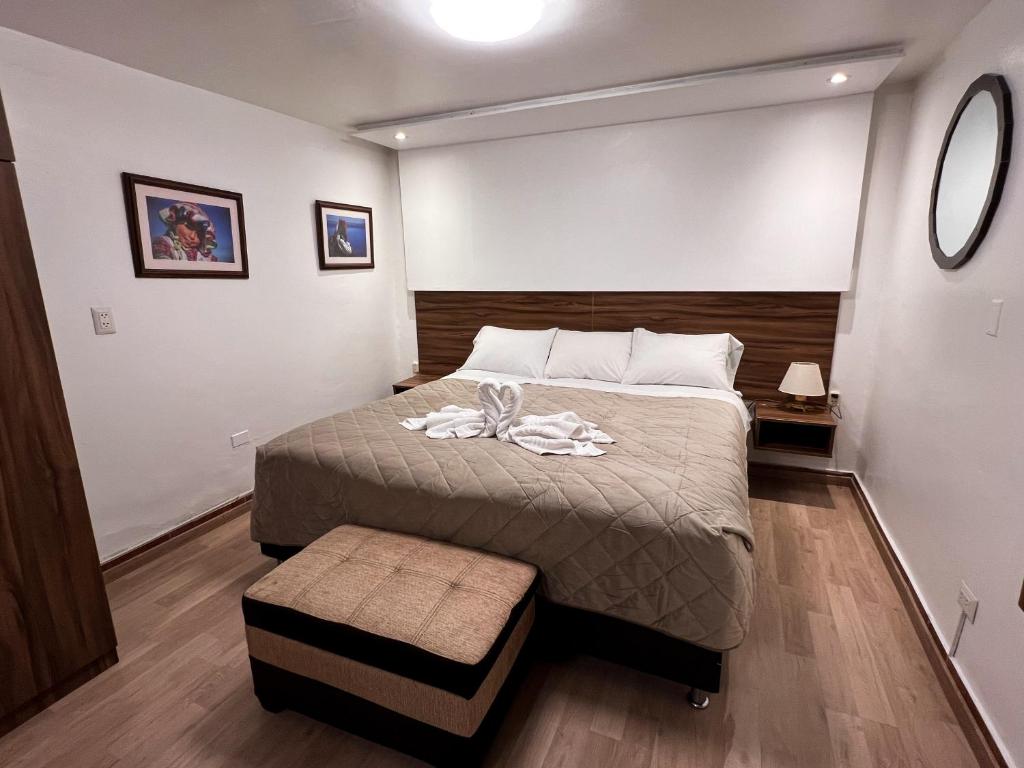 a bedroom with a bed in a small room at Inca Wasi Plaza de Armas in Cusco