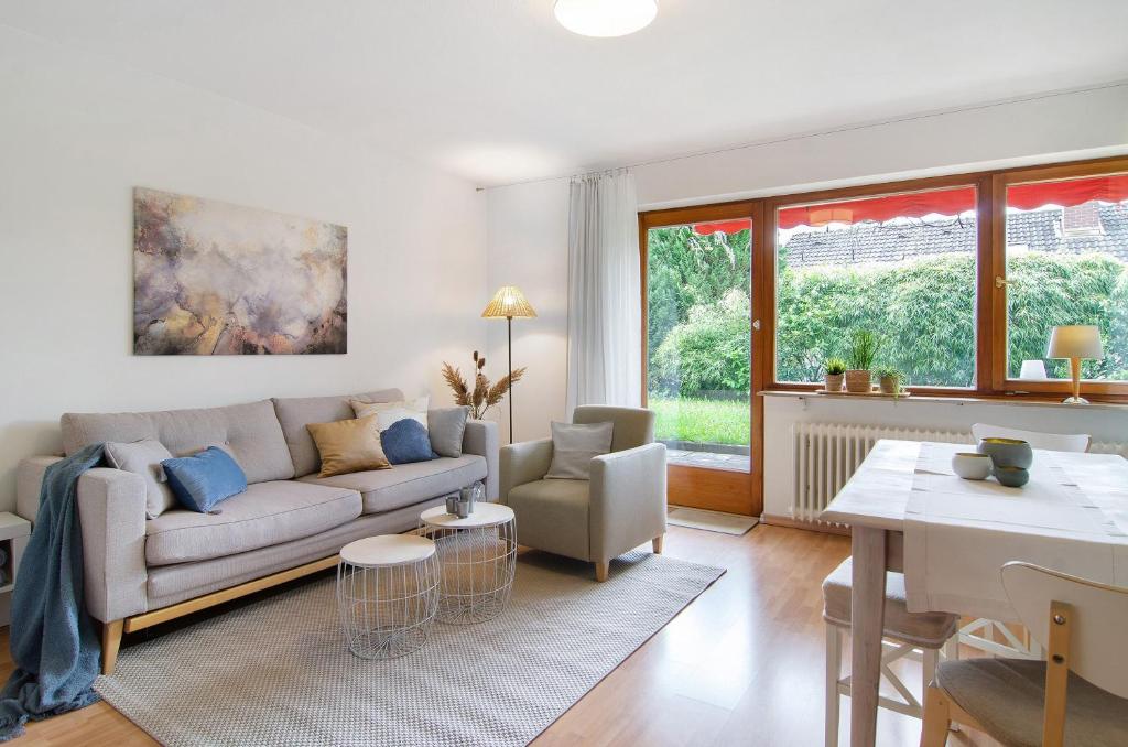 a living room with a couch and a table at Ferienwohnung Am Buchbühl in Stockach