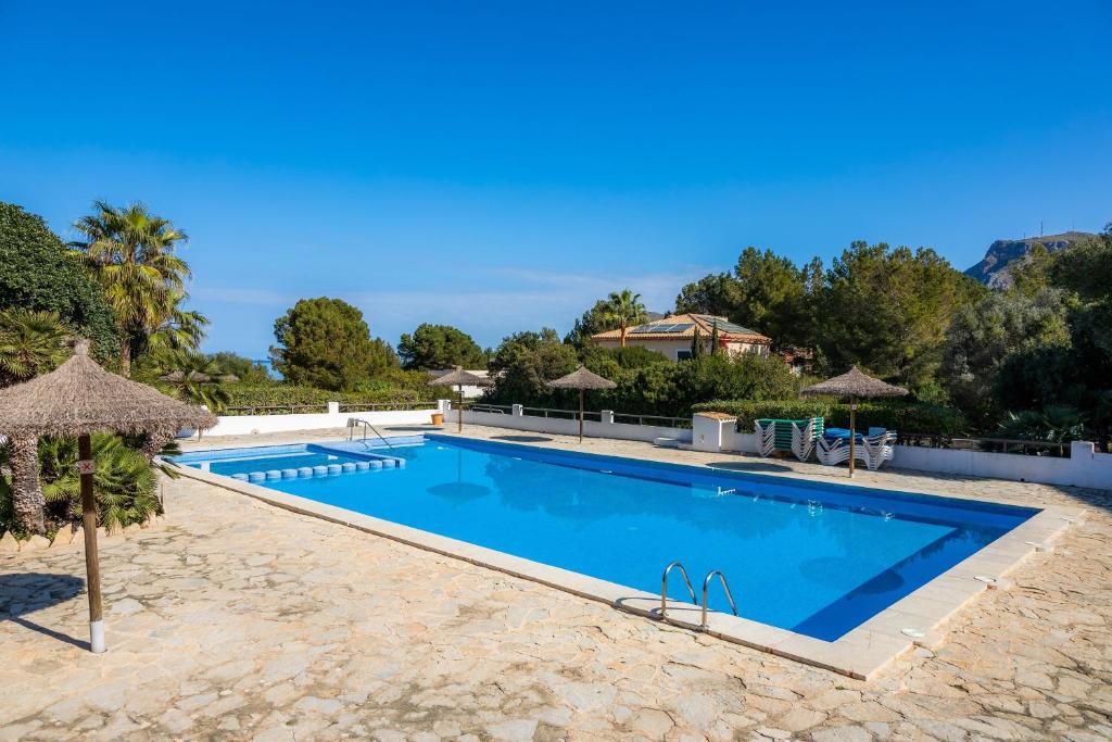 a swimming pool in a villa with a resort at Can Petit Estel in Betlem