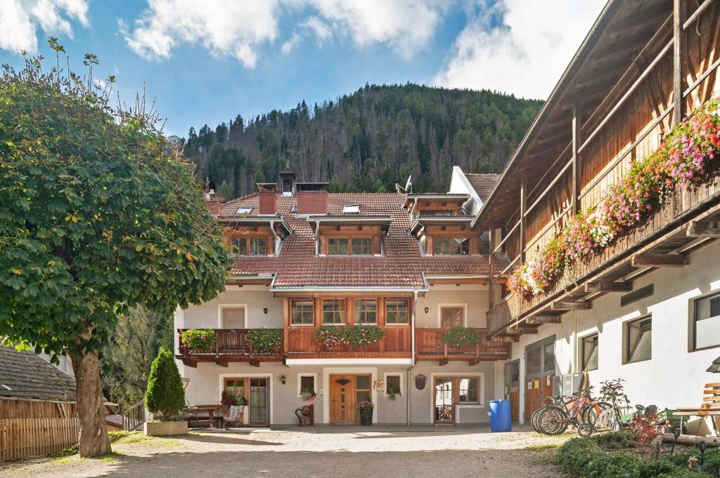 a large building with balconies on the side of it at Kaltenhauser Hof in Masserie
