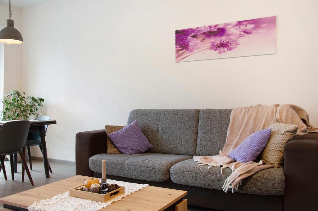 a living room with a couch and a table at Kornblume in Unterwittighausen